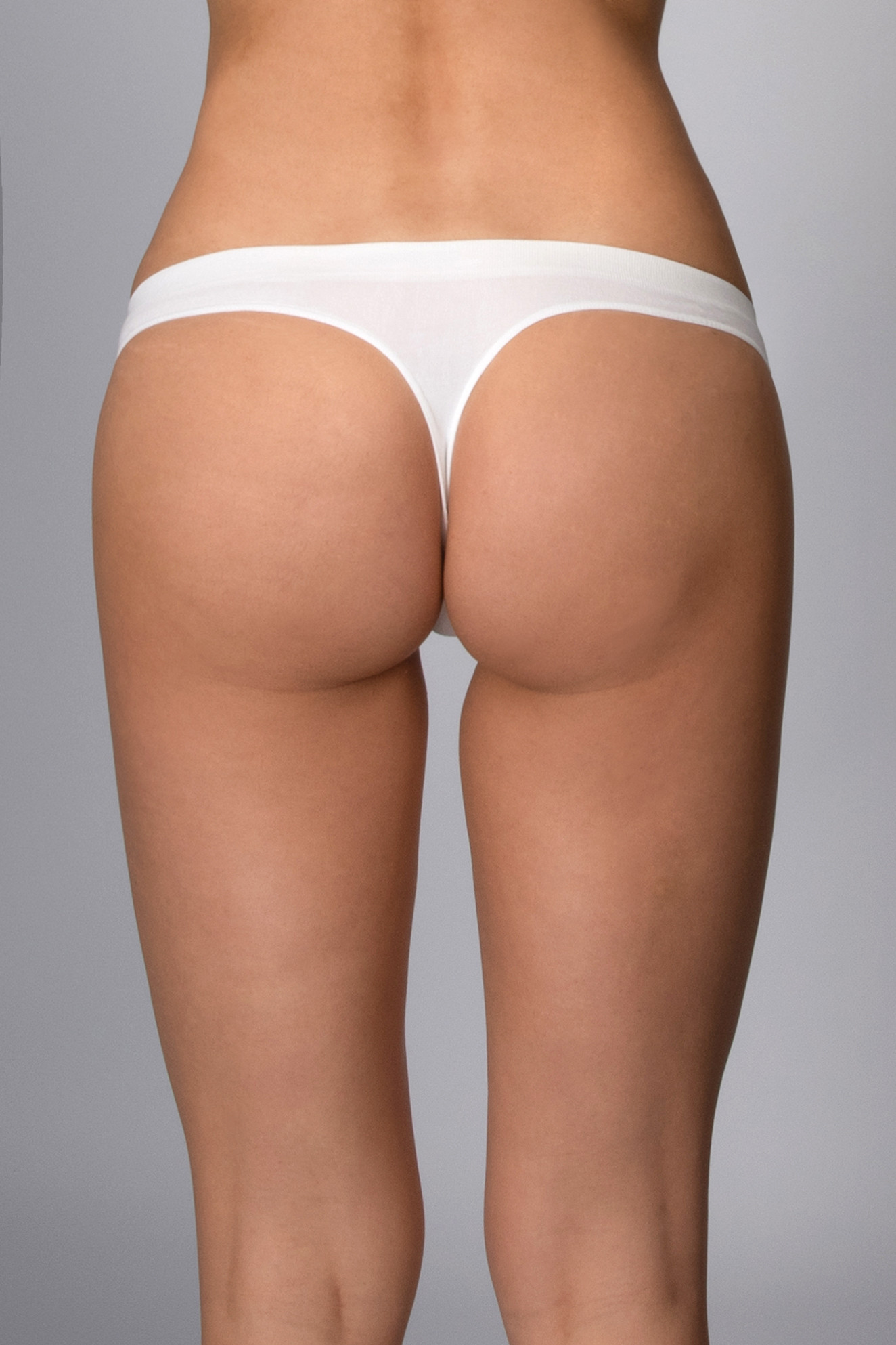 Kalhotky tanga s nízkým pasem bezešvé Perizoma vita bassa Intimidea Barva: Bílá, velikost S/M